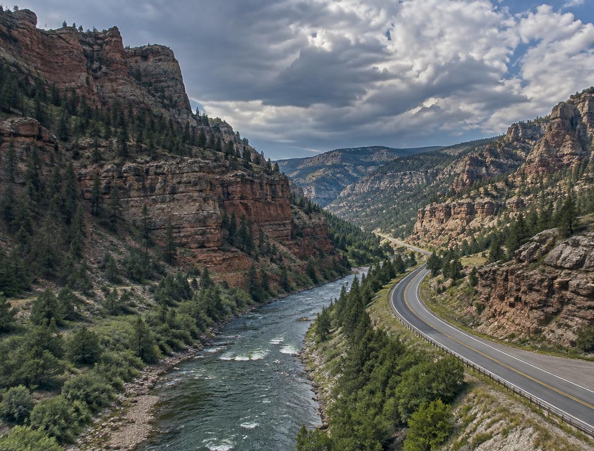 River and scenic highway winding through a canyon in Shoshone National Forest